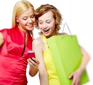 women-who are shopping in store with smartphone